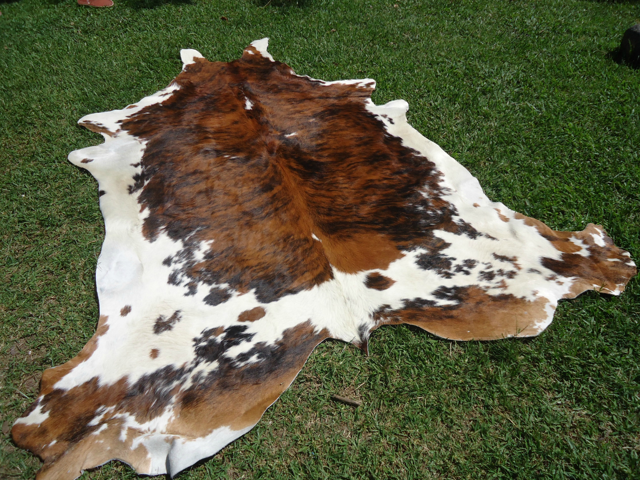 Ferdinand-Milk - A faux leather cow hide fabric from Chameleon